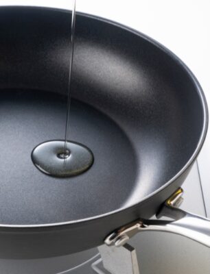 Heat oil in frying pan before adding vegetables