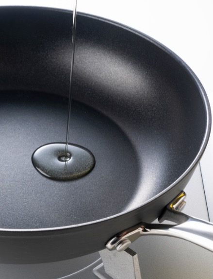 Heat oil in frying pan before adding vegetables